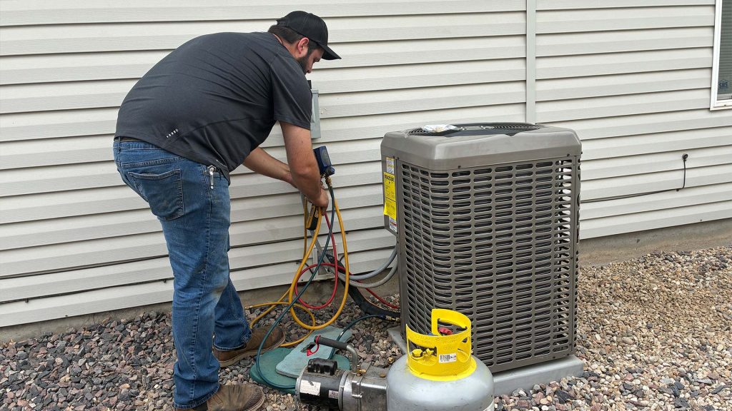 Technician connecting A/C unit wires