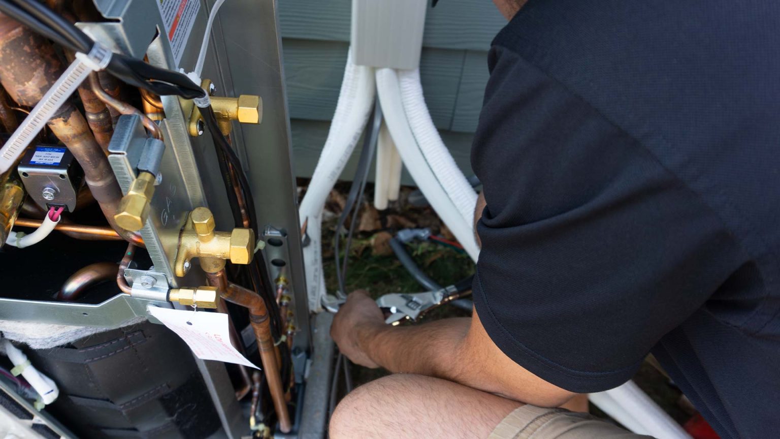 Technicians installing a ductless system