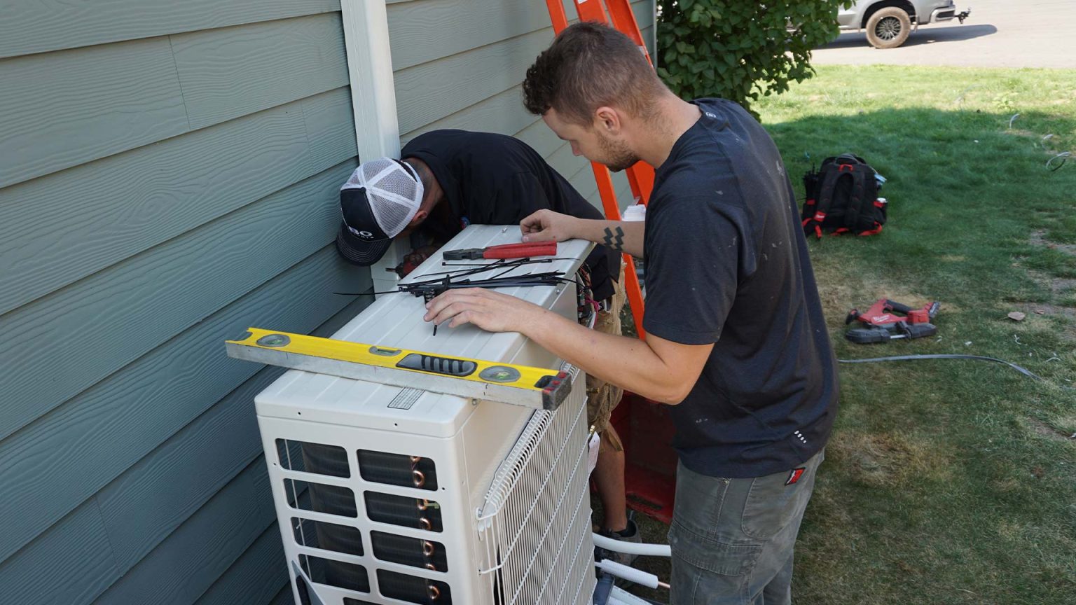 Technicians installing a ductless system